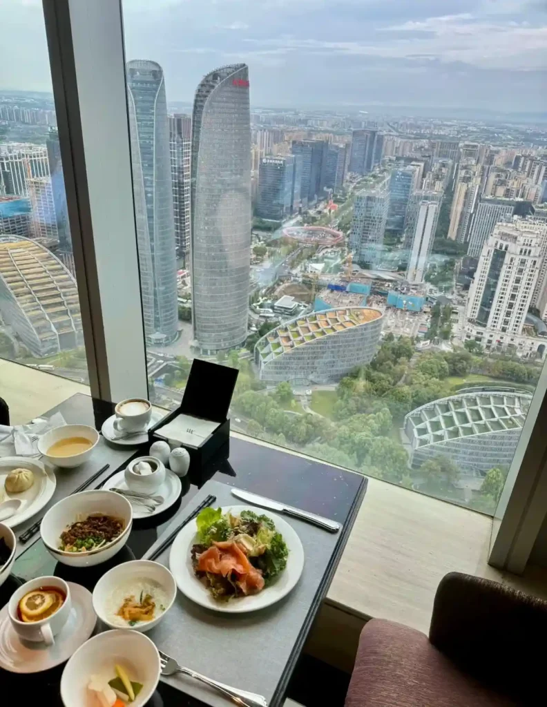 Breakfast spread with Chengdu skyline view at Waldorf Astoria